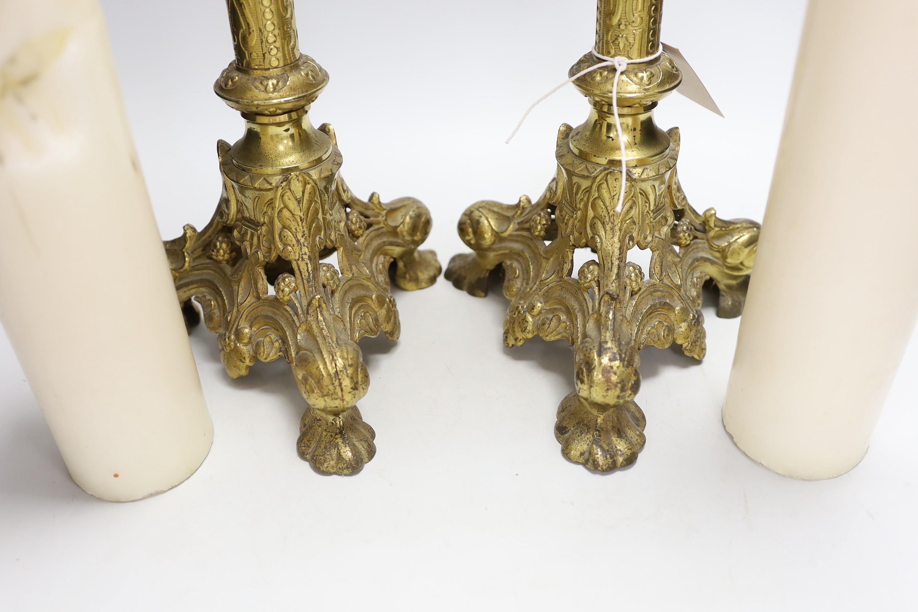 A pair of tall Victorian ecclesiastical brass candlestands, 51cms high